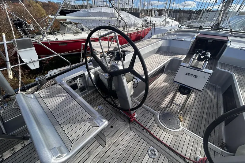  Yacht Photos Pics 2010 Hanse 545 yacht cockpit with dual steering wheels and teak decking.