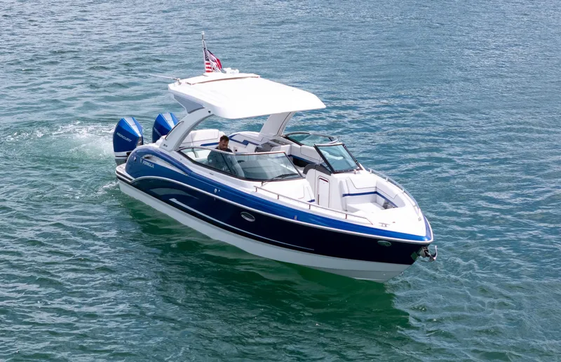  Yacht Photos Pics 2024 Formula 310 BR boat cruising on clear blue water.