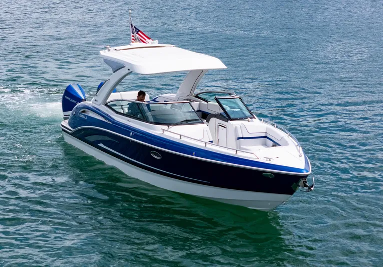  Yacht Photos Pics 2024 Formula 310 BR boat cruising on clear blue water.