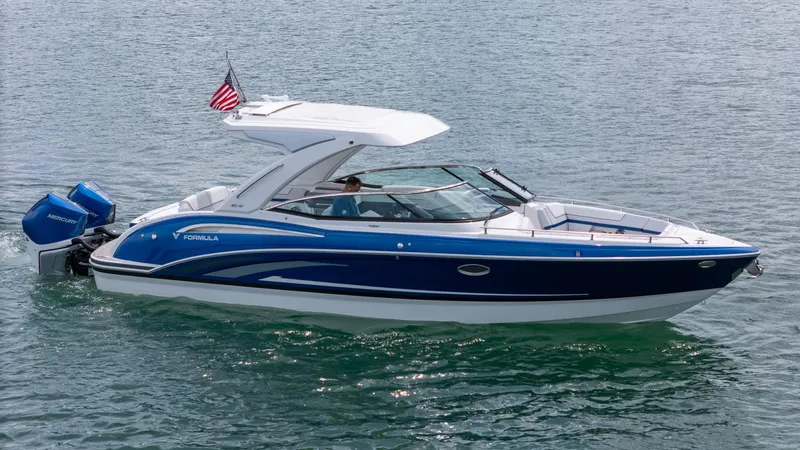 Yacht Photos Pics 2024 Formula 310 BR boat cruising on water with dual Mercury engines.