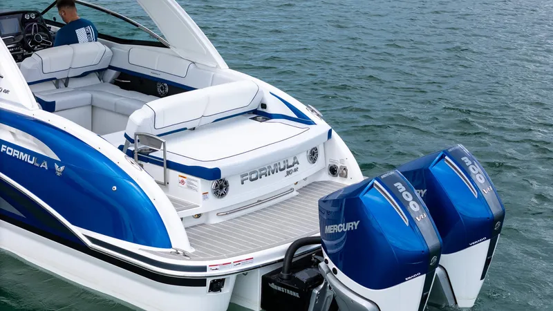  Yacht Photos Pics 2024 Formula 310 BR boat with dual Mercury outboard engines on water.