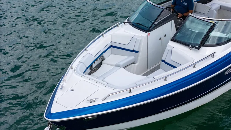  Yacht Photos Pics 2024 Formula 310 BR boat with sleek design on water, featuring blue and white accents.