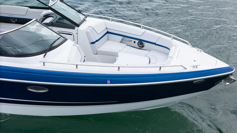  Yacht Photos Pics 2024 Formula 310 BR boat on water, featuring sleek design and spacious seating.