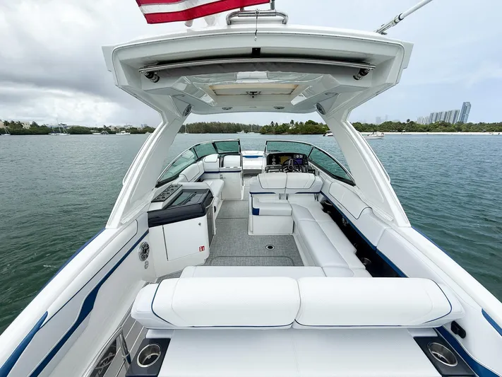  Yacht Photos Pics 2024 Formula 310 BR luxury boat interior with spacious seating and modern amenities on the water.