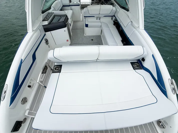  Yacht Photos Pics 2024 Formula 310 BR boat interior with white seating and sleek design on the water.