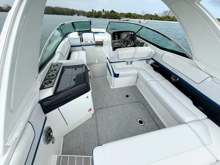  Yacht Photos Pics 2024 Formula 310 BR boat interior with luxurious seating and sleek design on the water.