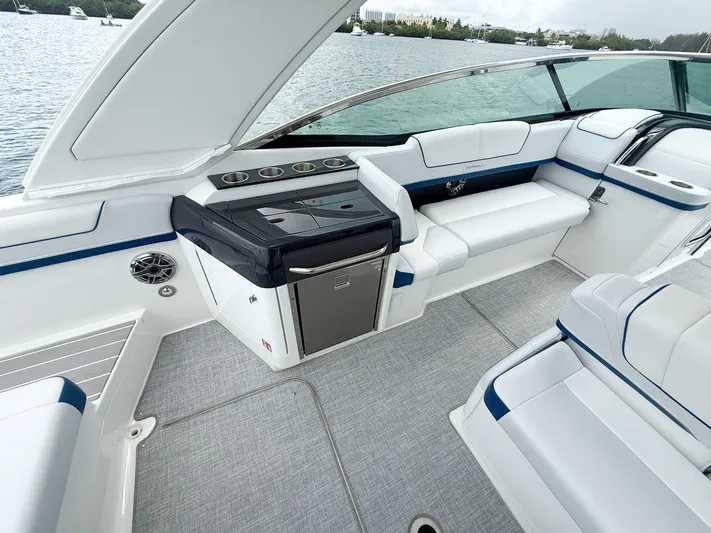  Yacht Photos Pics 2024 Formula 310 BR boat interior with sleek seating and modern amenities on the water.