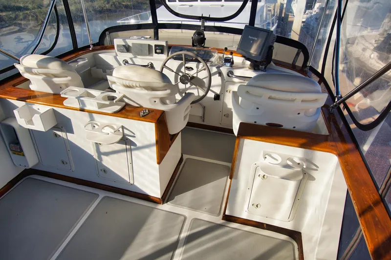 Funky Monkey Yacht Photos Pics Helm of 2001 Monk 36 (Hull #215) with dual seats and navigation equipment.