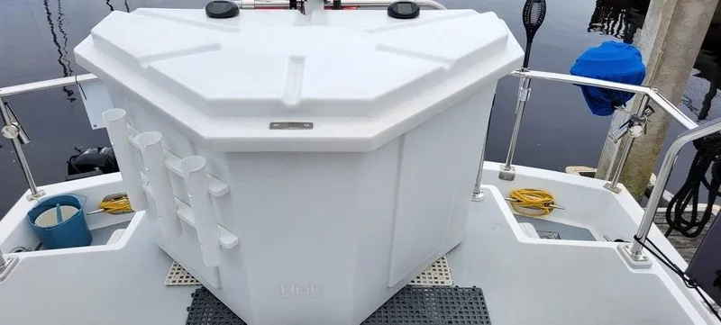 Funky Monkey Yacht Photos Pics White deck storage on 2001 Monk 36 boat, featuring rod holders and safety rails.