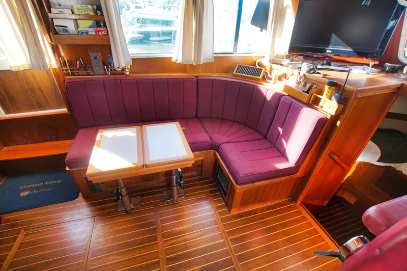 Funky Monkey Yacht Photos Pics Luxurious 2001 Monk 36 yacht interior with plush seating and wooden accents.