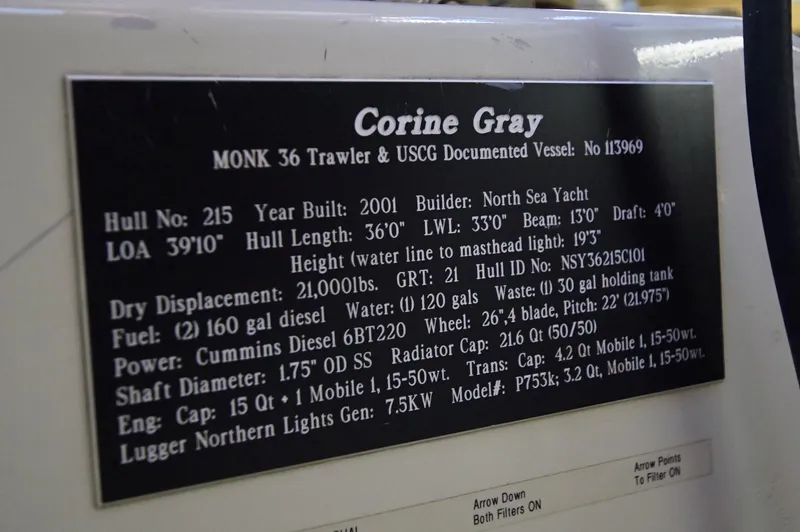 Funky Monkey Yacht Photos Pics Plaque detailing specifications of the 2001 Monk 36 Trawler, Hull #215.