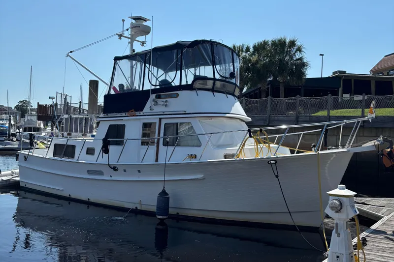 Funky Monkey Yacht Photos Pics 2001 Monk 36 (Hull #215) yacht docked at marina under clear blue sky.