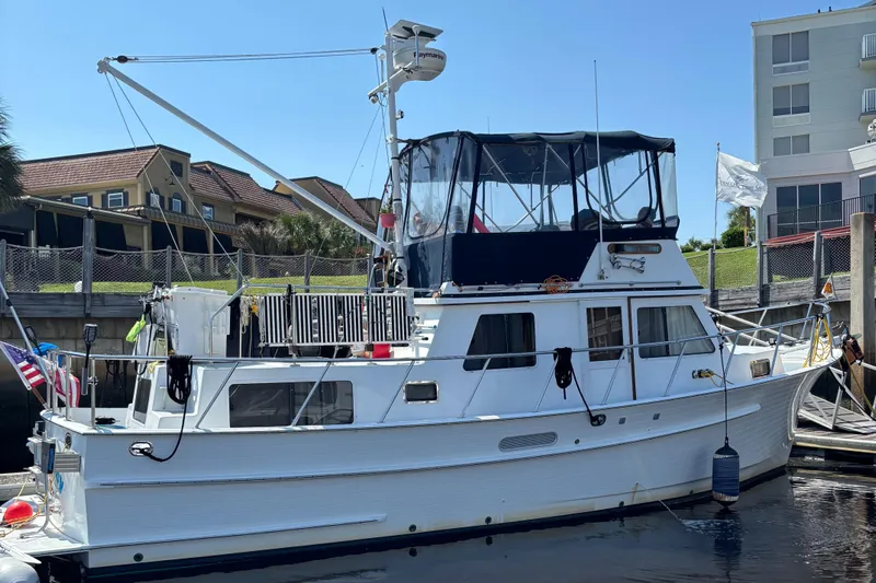 Funky Monkey Yacht Photos Pics 2001 Monk 36 (Hull #215) yacht docked at marina, featuring classic design and spacious deck.