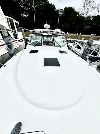  Yacht Photos Pics 2007 Tiara Yachts 3600 Open docked, showcasing sleek design and spacious deck.