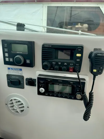  Yacht Photos Pics 2007 Tiara Yachts 3600 Open dashboard with marine radio and control panel.