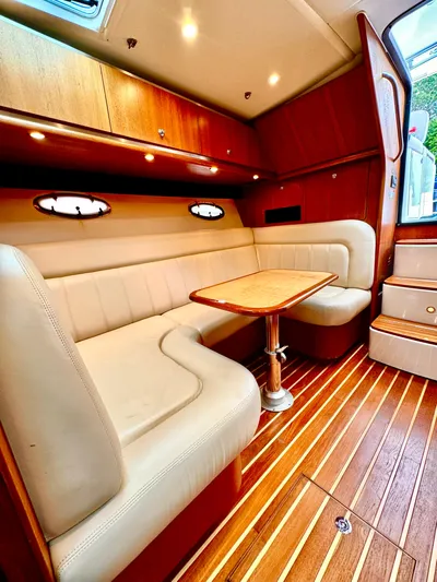  Yacht Photos Pics 2007 Tiara Yachts 3600 Open interior with elegant seating and wooden flooring.
