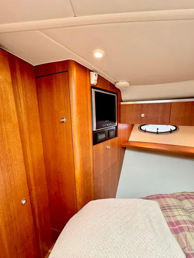  Yacht Photos Pics 2007 Tiara Yachts 3600 Open cabin interior with wood paneling and TV.