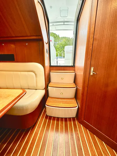  Yacht Photos Pics 2007 Tiara Yachts 3600 Open interior with wooden stairs and seating.