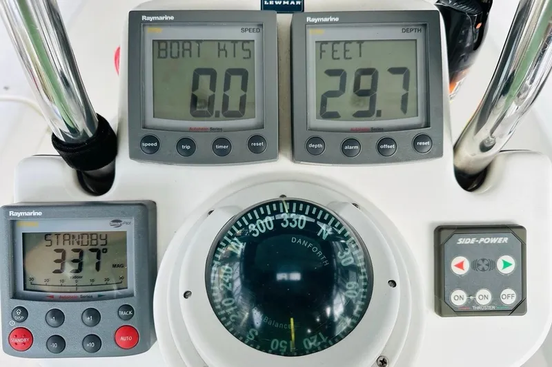 Free Range Yacht Photos Pics Control panel of a 2005 Hunter 44 sailboat with navigation instruments.