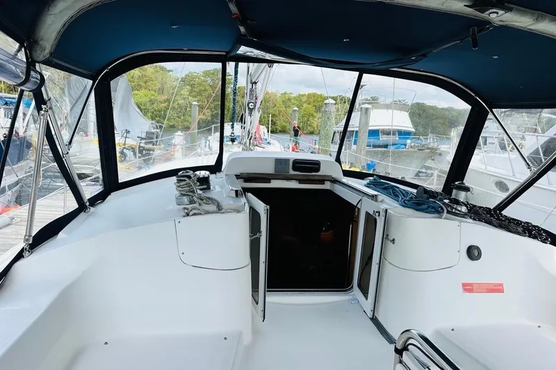 Free Range Yacht Photos Pics Cockpit view of a 2005 Hunter 44 sailboat docked at a marina.
