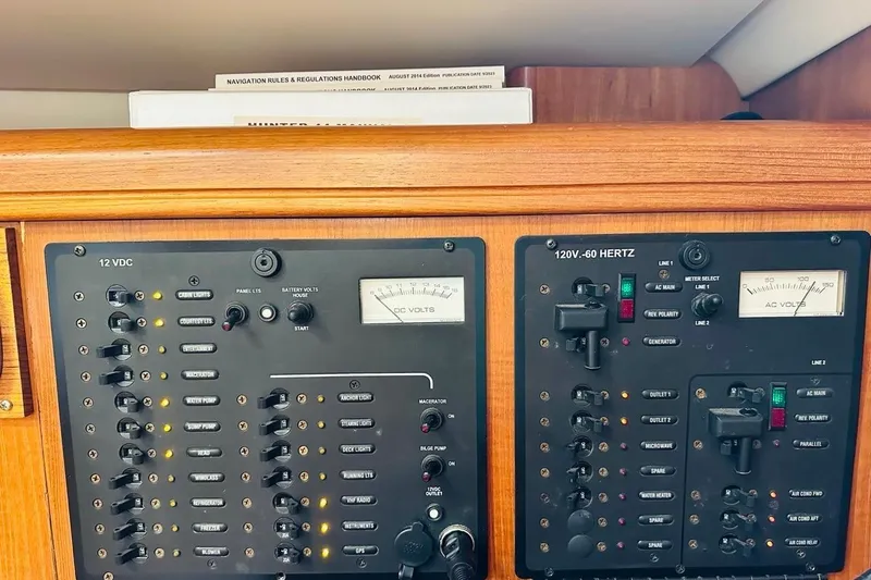 Free Range Yacht Photos Pics Electrical control panel on a 2005 Hunter 44 sailboat, featuring 12VDC and 120V-60 Hertz systems.