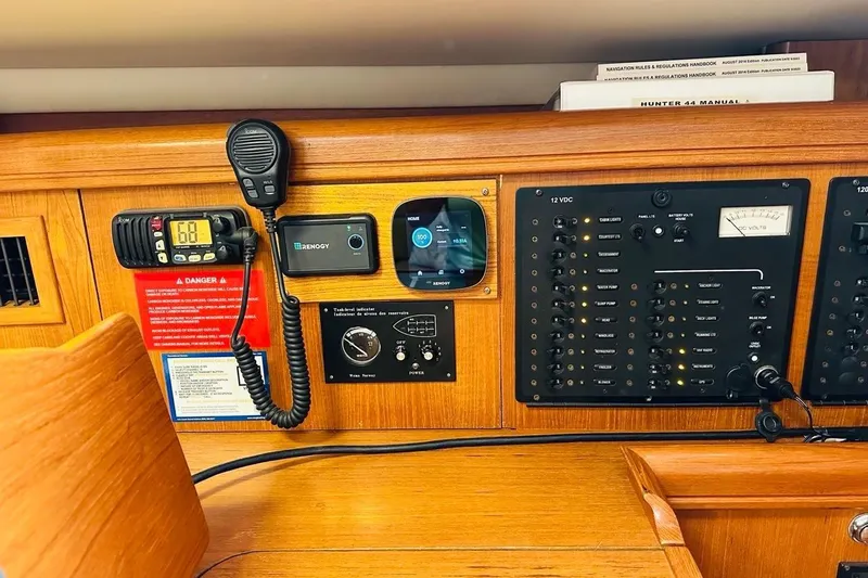 Free Range Yacht Photos Pics Control panel of a 2005 Hunter 44 sailboat with communication and navigation equipment.