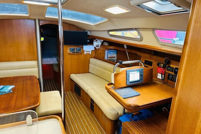 Free Range Yacht Photos Pics Interior of a 2005 Hunter 44 sailboat with wood finish and navigation equipment.