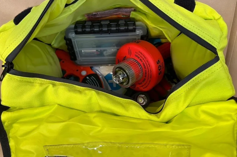 Free Range Yacht Photos Pics Yellow bag with emergency tools and supplies, including an SOS canister, for a Hunter 44, 2005.