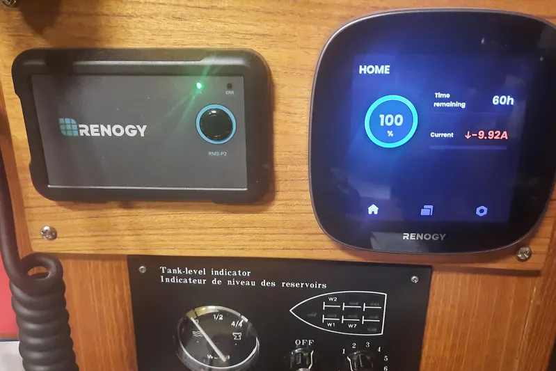 Free Range Yacht Photos Pics Renogy power monitor and tank-level indicator on 2005 Hunter 44 boat dashboard.