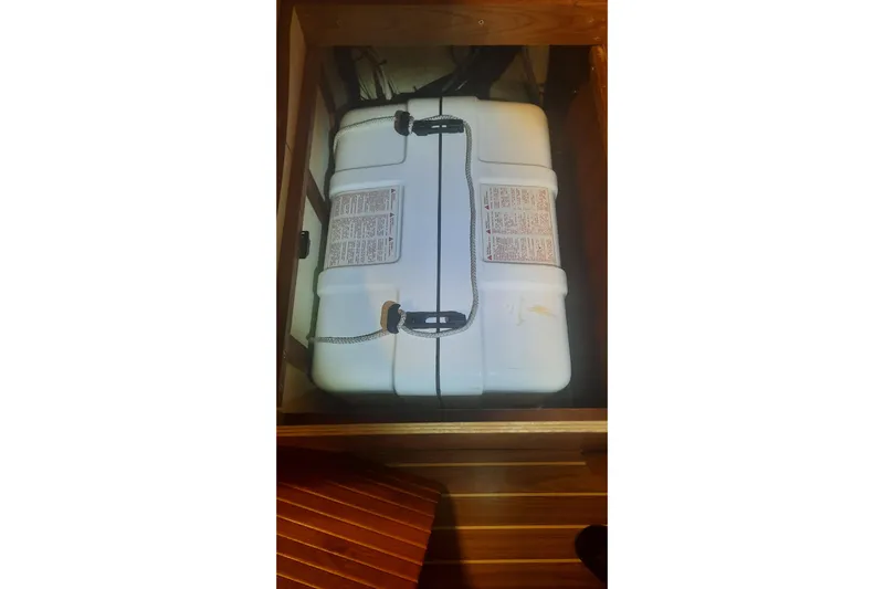 Free Range Yacht Photos Pics White storage container inside a 2005 Hunter 44 boat compartment.