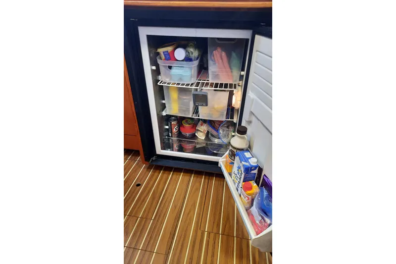 Free Range Yacht Photos Pics Open refrigerator on Hunter 44 yacht, stocked with various food and drinks, 2005 model.