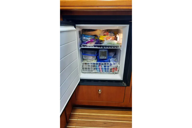 Free Range Yacht Photos Pics Open freezer on a 2005 Hunter 44 yacht, stocked with various frozen foods.