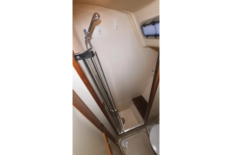 Free Range Yacht Photos Pics Shower area in 2005 Hunter 44 yacht, featuring compact design and modern fixtures.