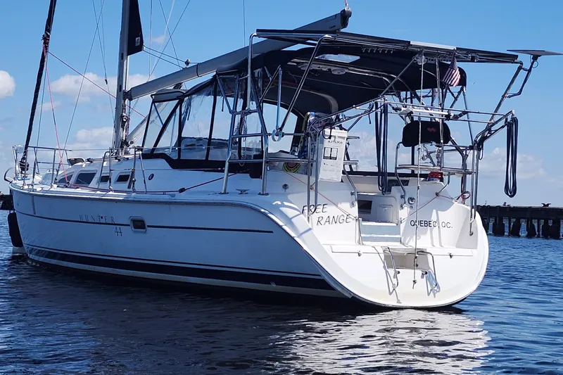 Free Range Yacht Photos Pics 2005 Hunter 44 sailboat on water, clear sky, rear view, Quebec registration.