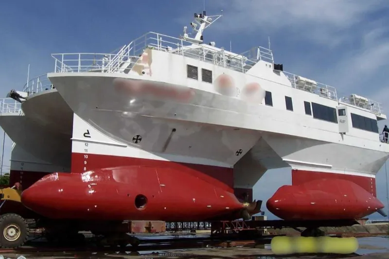  Yacht Photos Pics FBMA Philippines 2006 SWATH Slice Crew Transport Vessel on dry dock, red and white hull.