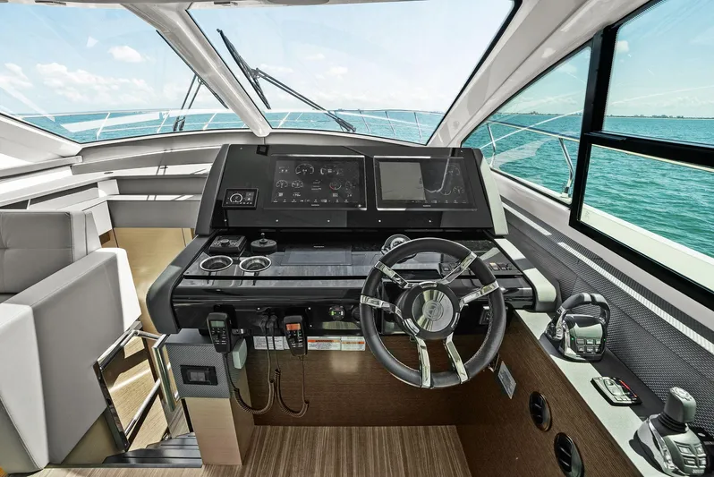 Mi Wave Yacht Photos Pics 2021 Cruisers 60 Cantius yacht helm with modern controls and panoramic sea view.