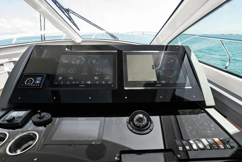Mi Wave Yacht Photos Pics Helm of 2021 Cruisers 60 Cantius yacht with advanced navigation displays and controls.