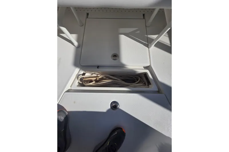  Yacht Photos Pics 2024 SeaVee 420Z boat deck with storage compartment and rope.
