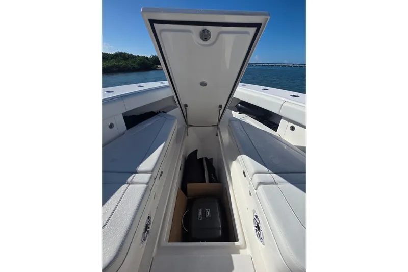  Yacht Photos Pics 2024 SeaVee 420Z boat storage compartment open, showcasing spacious interior design.