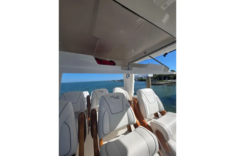 Yacht Photos Pics 2024 SeaVee 420Z boat interior with luxurious seating and ocean view.