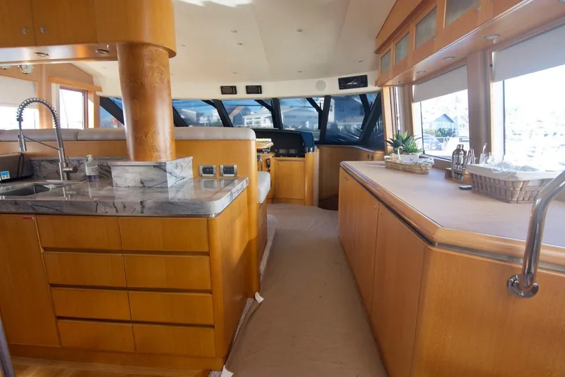 T.t. Amore Yacht Photos Pics Luxurious 2004 West Bay Cockpit Pilot House Motoryacht interior with modern kitchen and panoramic windows.