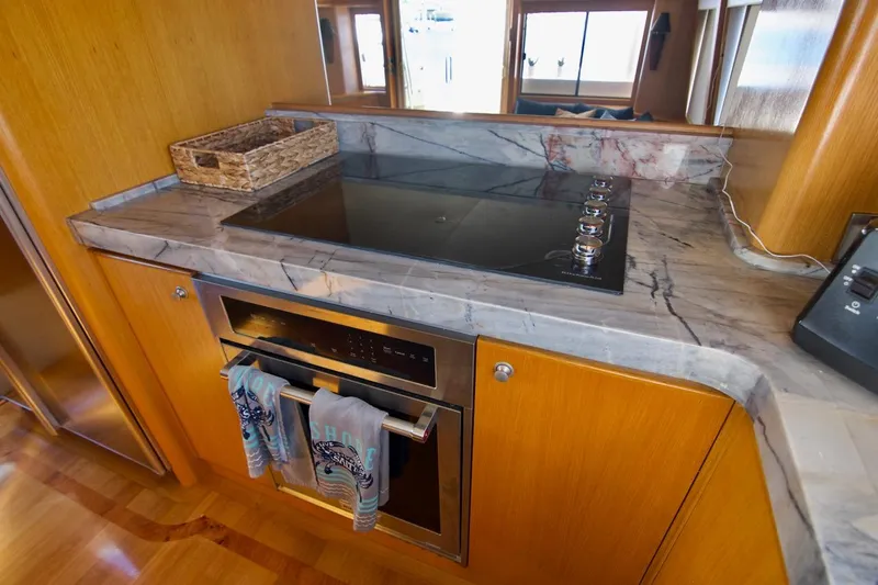 T.t. Amore Yacht Photos Pics Luxurious kitchen in 2004 West Bay Cockpit Pilot House Motoryacht with marble countertops.