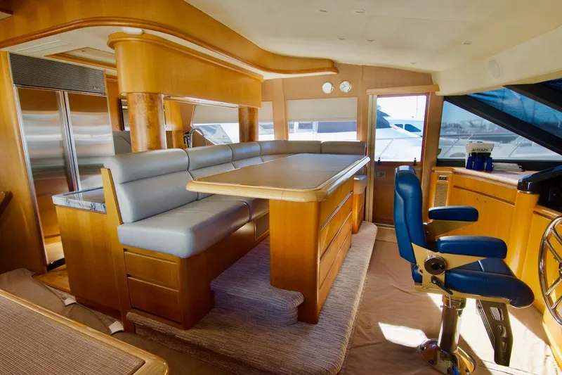 T.t. Amore Yacht Photos Pics Luxurious 2004 West Bay Cockpit Pilot House Motoryacht interior with elegant seating and helm.