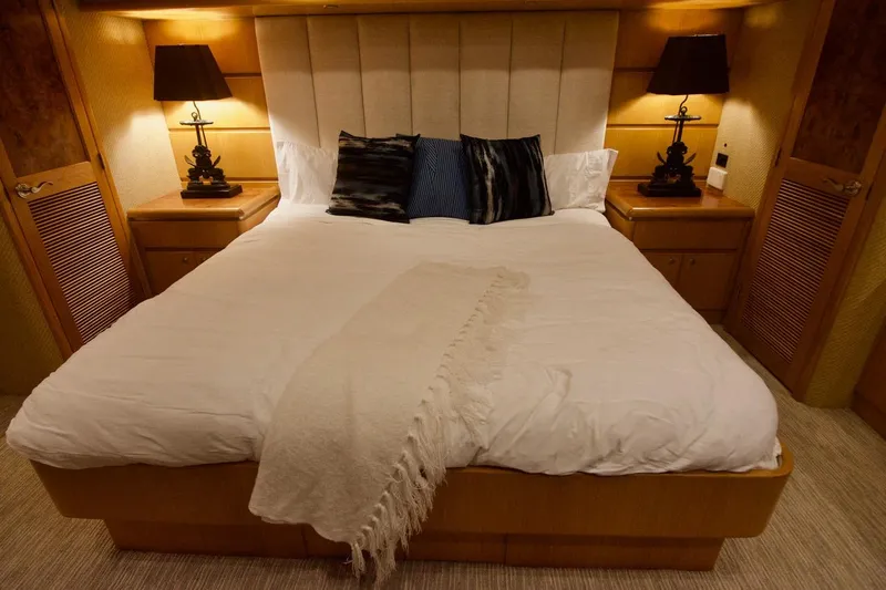 T.t. Amore Yacht Photos Pics Luxurious bedroom in 2004 West Bay Cockpit Pilot House Motoryacht with elegant decor.