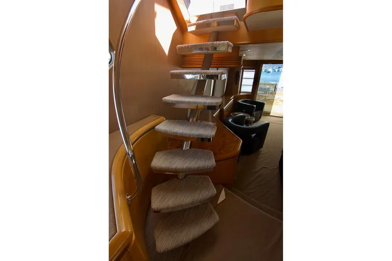 T.t. Amore Yacht Photos Pics Interior staircase of 2004 West Bay Cockpit Pilot House Motoryacht, featuring modern design and plush seating.