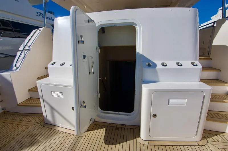 T.t. Amore Yacht Photos Pics 2004 West Bay Cockpit Pilot House Motoryacht entrance with open door and teak flooring.