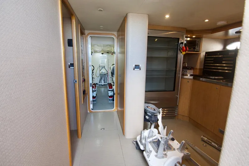 T.t. Amore Yacht Photos Pics 2004 West Bay Cockpit Pilot House Motoryacht interior with modern kitchen and engine room view.