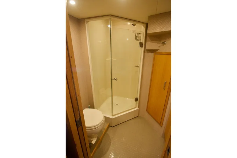 T.t. Amore Yacht Photos Pics Bathroom in 2004 West Bay Cockpit Pilot House Motoryacht with shower and toilet.