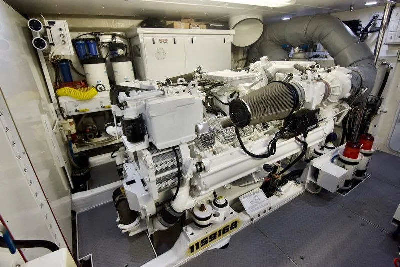 T.t. Amore Yacht Photos Pics Engine room of a 2004 West Bay Cockpit Pilot House Motoryacht, showcasing machinery and equipment.