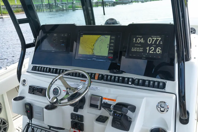  Yacht Photos Pics 2018 Hydra-Sports 3900 Speciale boat dashboard with navigation screens and controls.